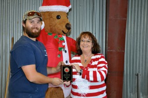 Gena Linebarger presents the 2nd place Chili Cook-off award to Ryan Linebarger.