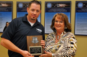 Colonel of the Year Michael Clinton accepts his award from Wing Leader Gena Linebarger.
