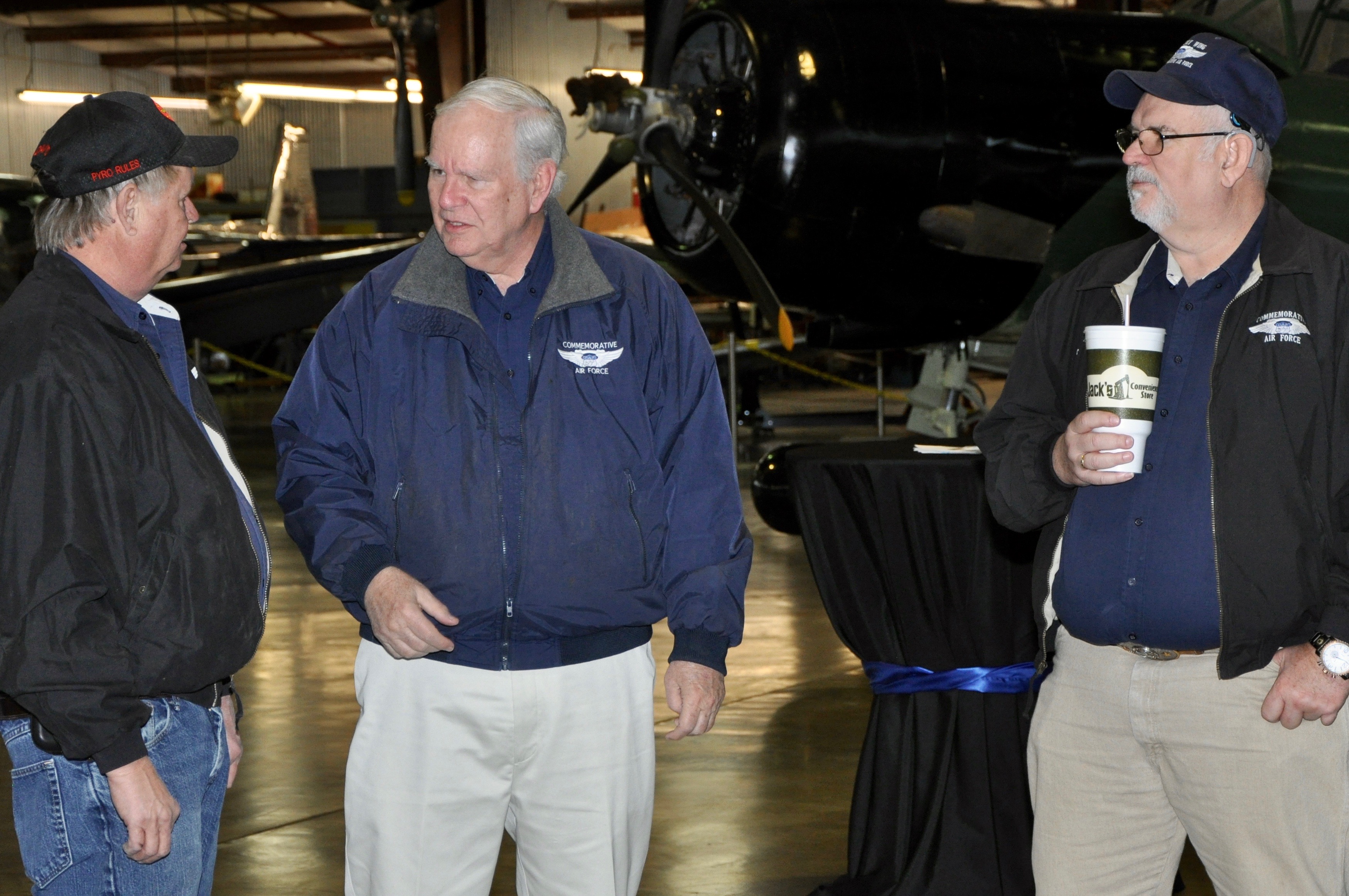 HSW members David Linebarger of the Blastards, Bill Coombes the wing PIO and Paul Cooper socialize during the event.