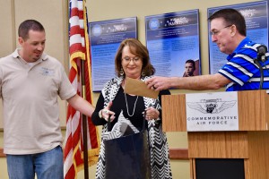 Executive Officer Michael Clinton (l) and 2017-2018 Wing Leader Brent Collins, present outgoing Wing Leader Gena Linebarger with gifts of appreciation.